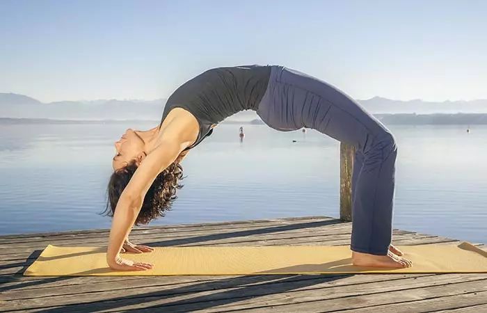 Chakrasana wheel pose yoga for belly fat reduction and flexibility